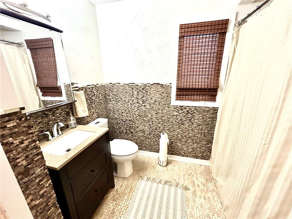 113 Memorial Street Dunbar, PA 15431 - Photo 26 of 42 a bathroom with a sink toilet and mirror