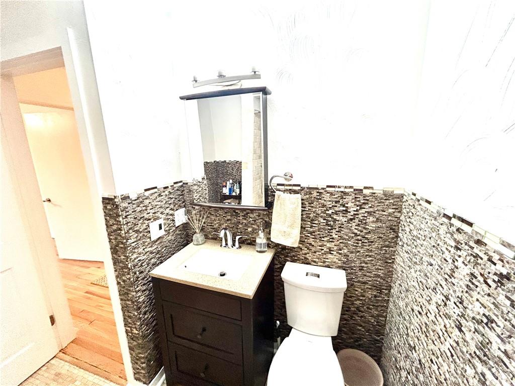 113 Memorial Street Dunbar, PA 15431 - Photo 27 of 42 a bathroom with a toilet sink and mirror