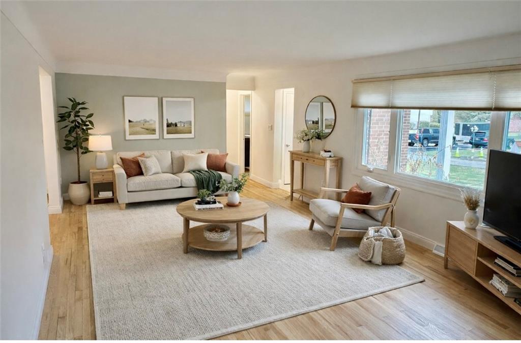 113 Memorial Street Dunbar, PA 15431 - Photo 40 of 42 a living room with furniture fireplace and a flat screen tv