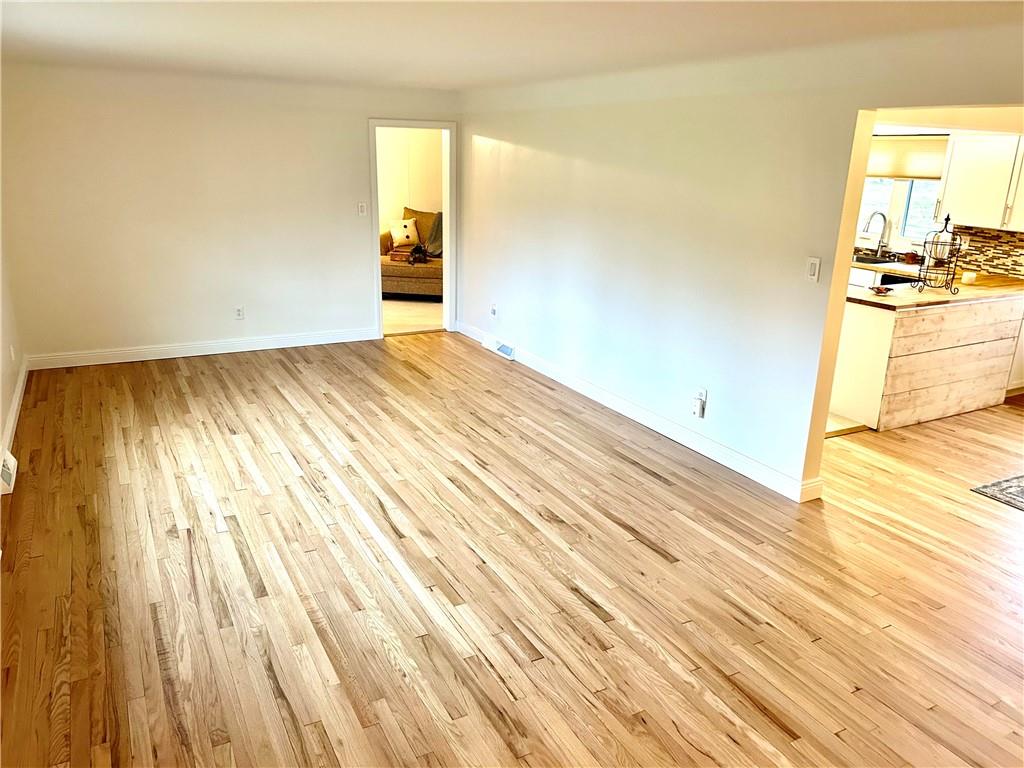 113 Memorial Street Dunbar, PA 15431 - Photo 10 of 42 a view of a room with wooden floor and a sink