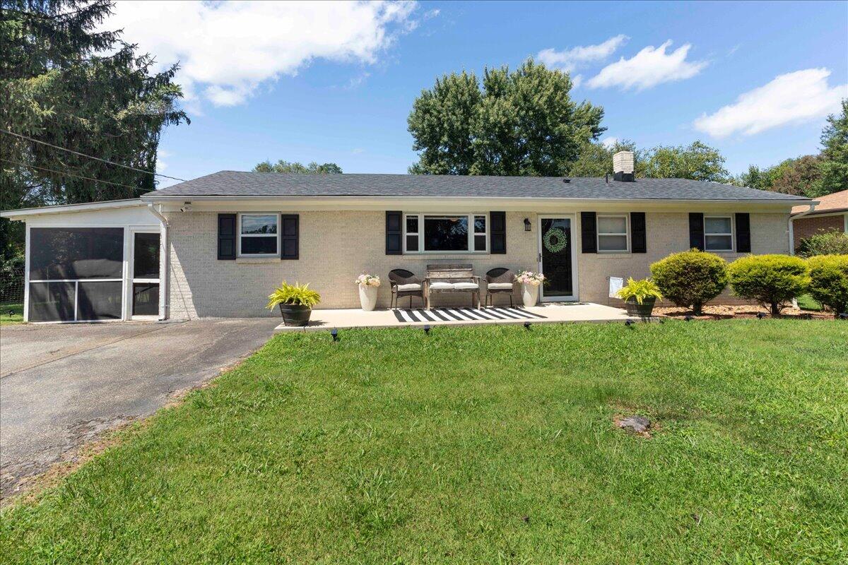 113 Ridge Street Madison Heights, VA 24572 - Photo 3 of 36 a front view of house with yard and outdoor seating