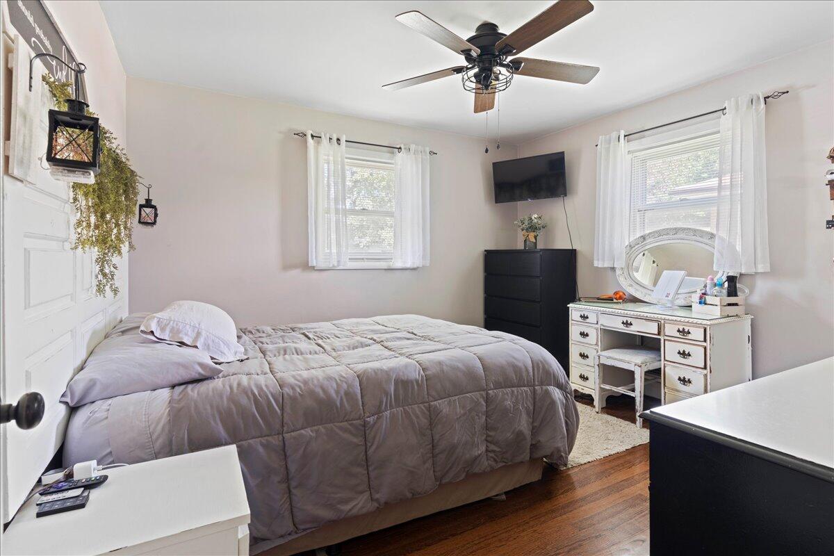 113 Ridge Street Madison Heights, VA 24572 - Photo 32 of 36 a bedroom with a bed and a flat screen tv
