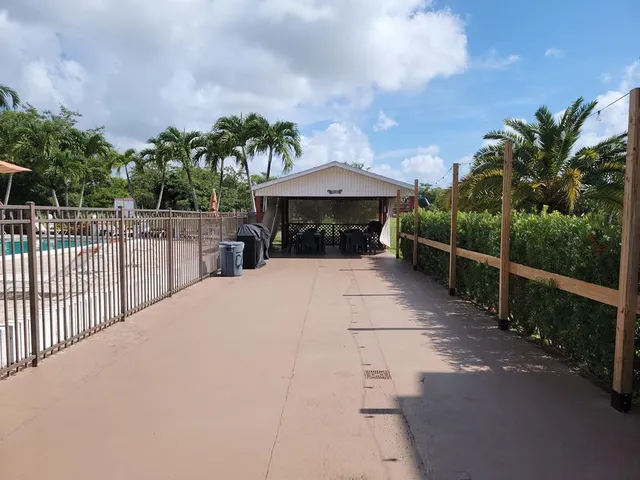a view of a house with swimming pool and yard