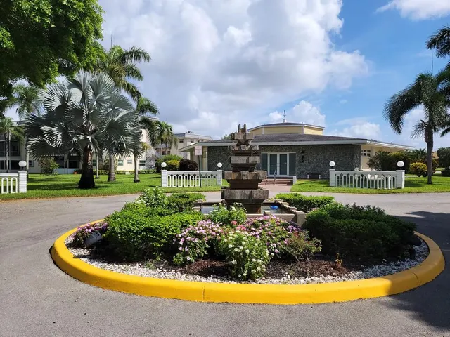 an aerial view of a garden with lawn chairs