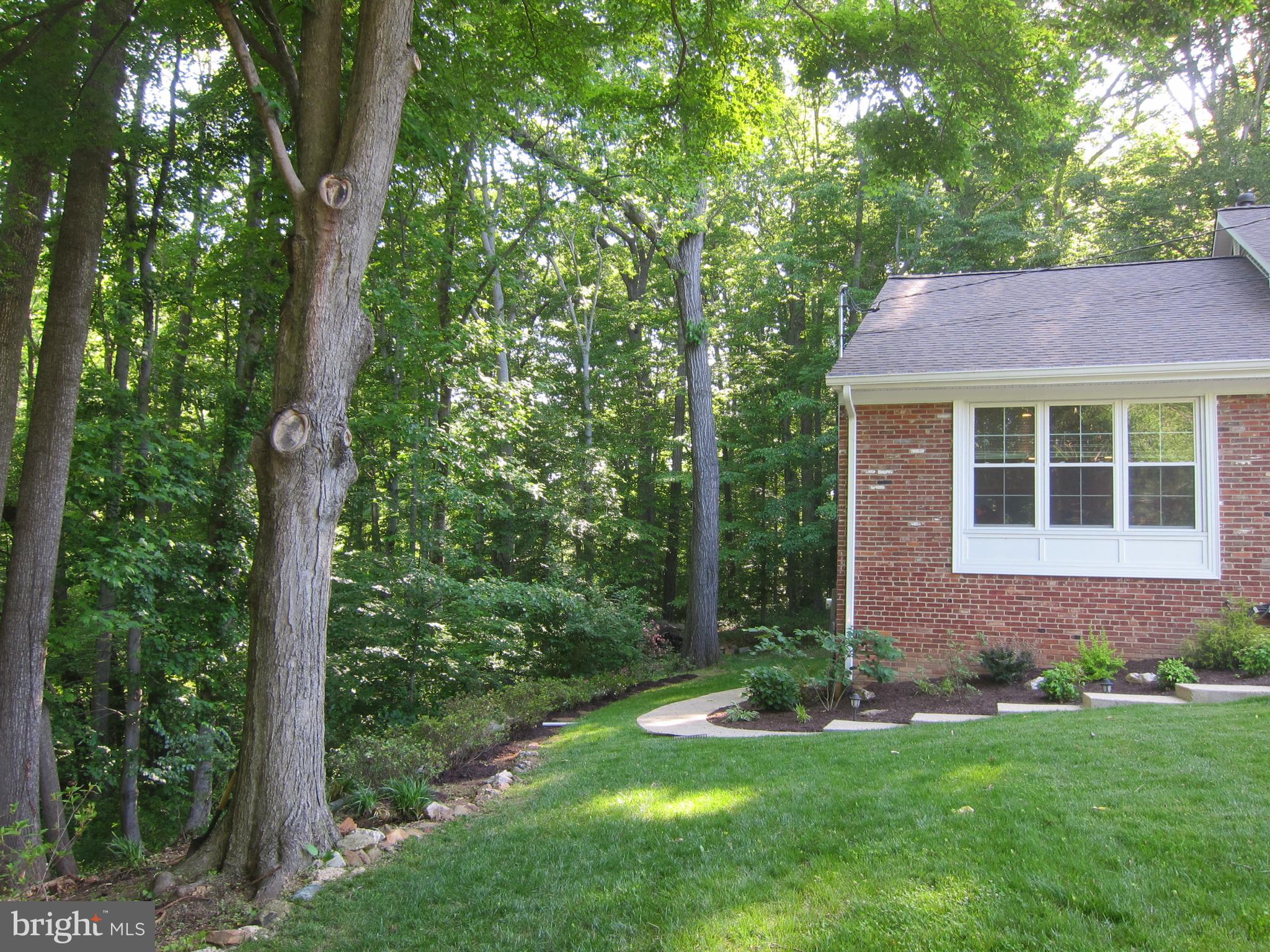 8543 Howell Road Bethesda, MD 20817 - Photo 4 of 24 a view of a house with a yard