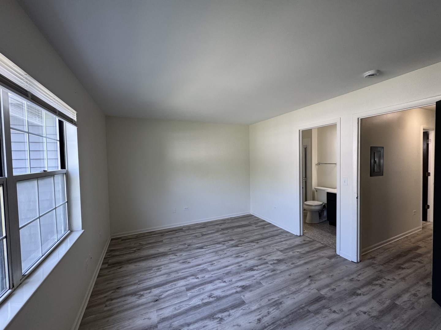 458 North Lake Shore Drive Palatine, IL 60067 - Photo 12 of 25 a view of an empty room with wooden floor and a window