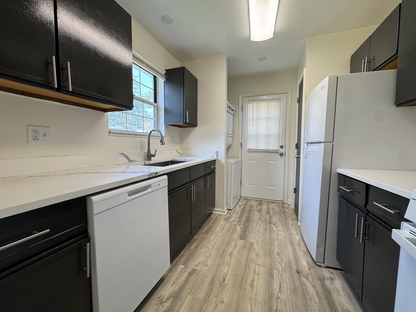 458 North Lake Shore Drive Palatine, IL 60067 - Photo 15 of 25 a kitchen with a sink stainless steel appliances a counter space and cabinets