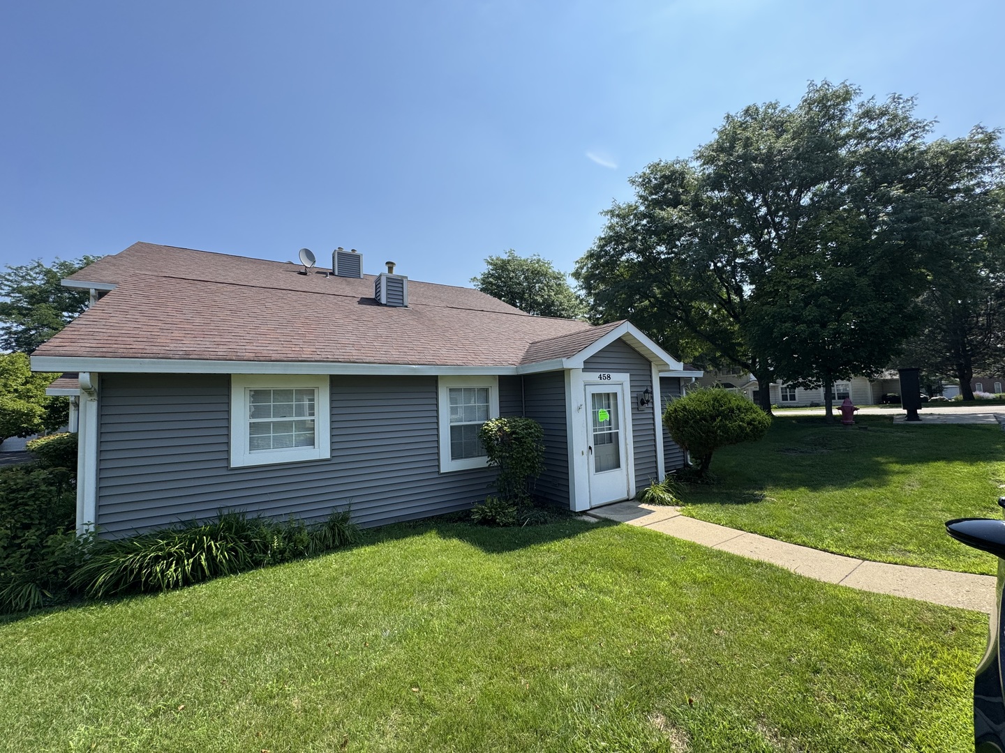 458 North Lake Shore Drive Palatine, IL 60067 - Photo 2 of 25 a front view of a house with garden
