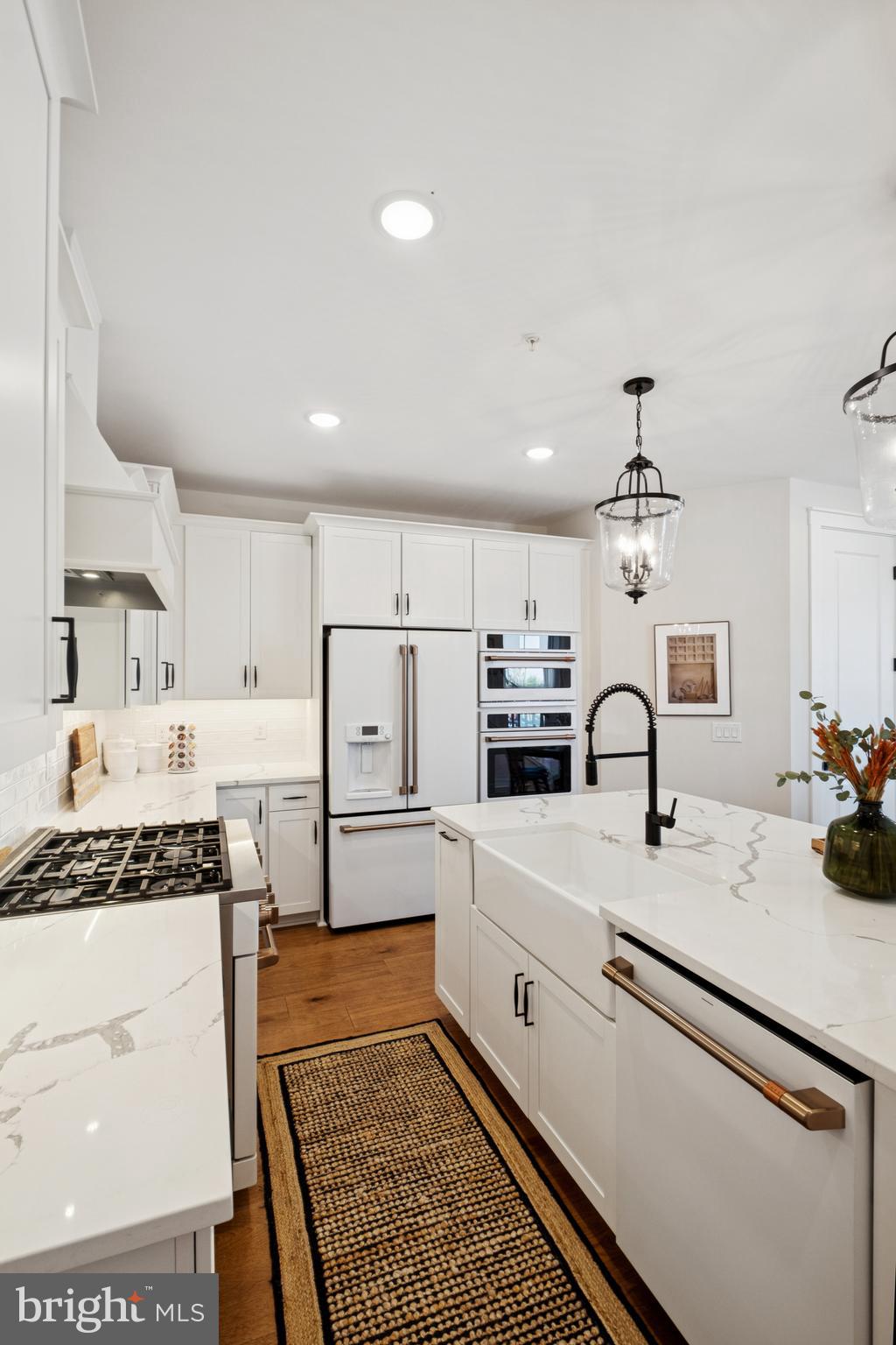 14960 Deco Circle Chantilly, VA 20151 - Photo 9 of 35 a kitchen with a sink stove and white cabinets