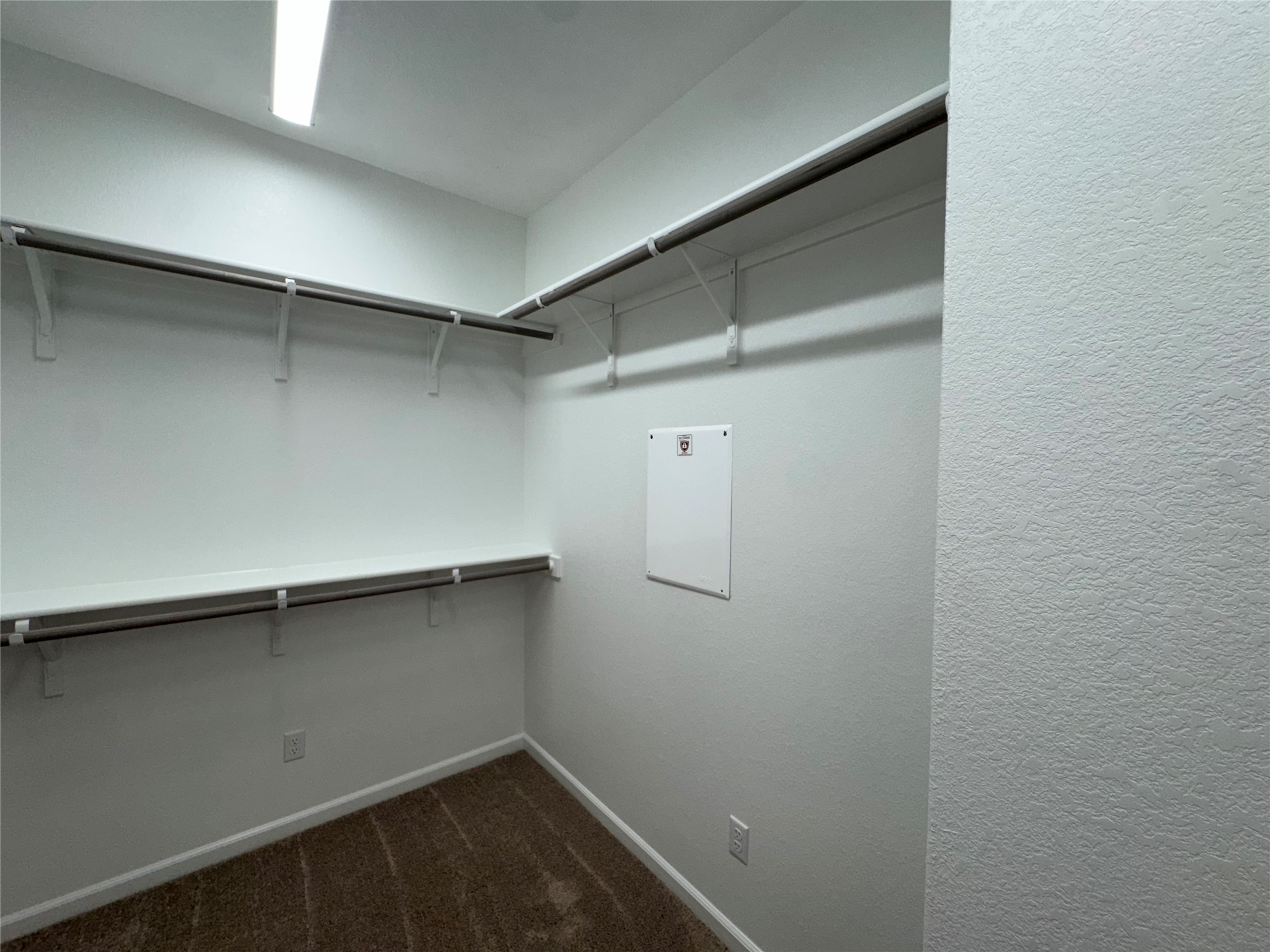 3000 Chisholm Trail Road, Unit 41 Round Rock, TX 78681 - Photo 15 of 28 Thoughtfully designed for optimal organization, this walk-in closet offers ample storage with built-in shelving and hanging rods.