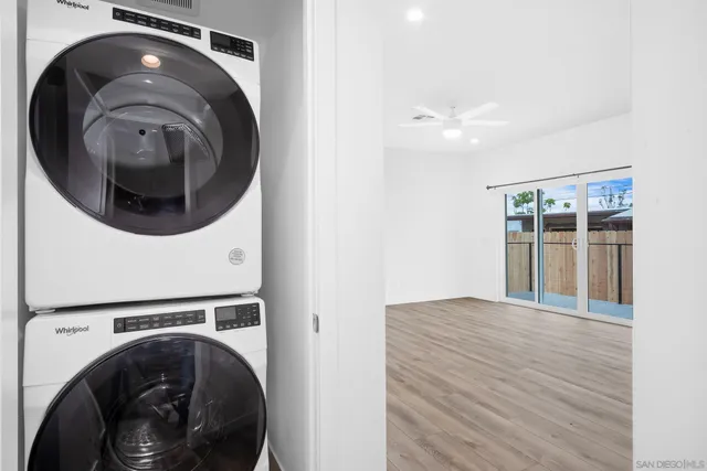 a view of a hallway with washer and dryer