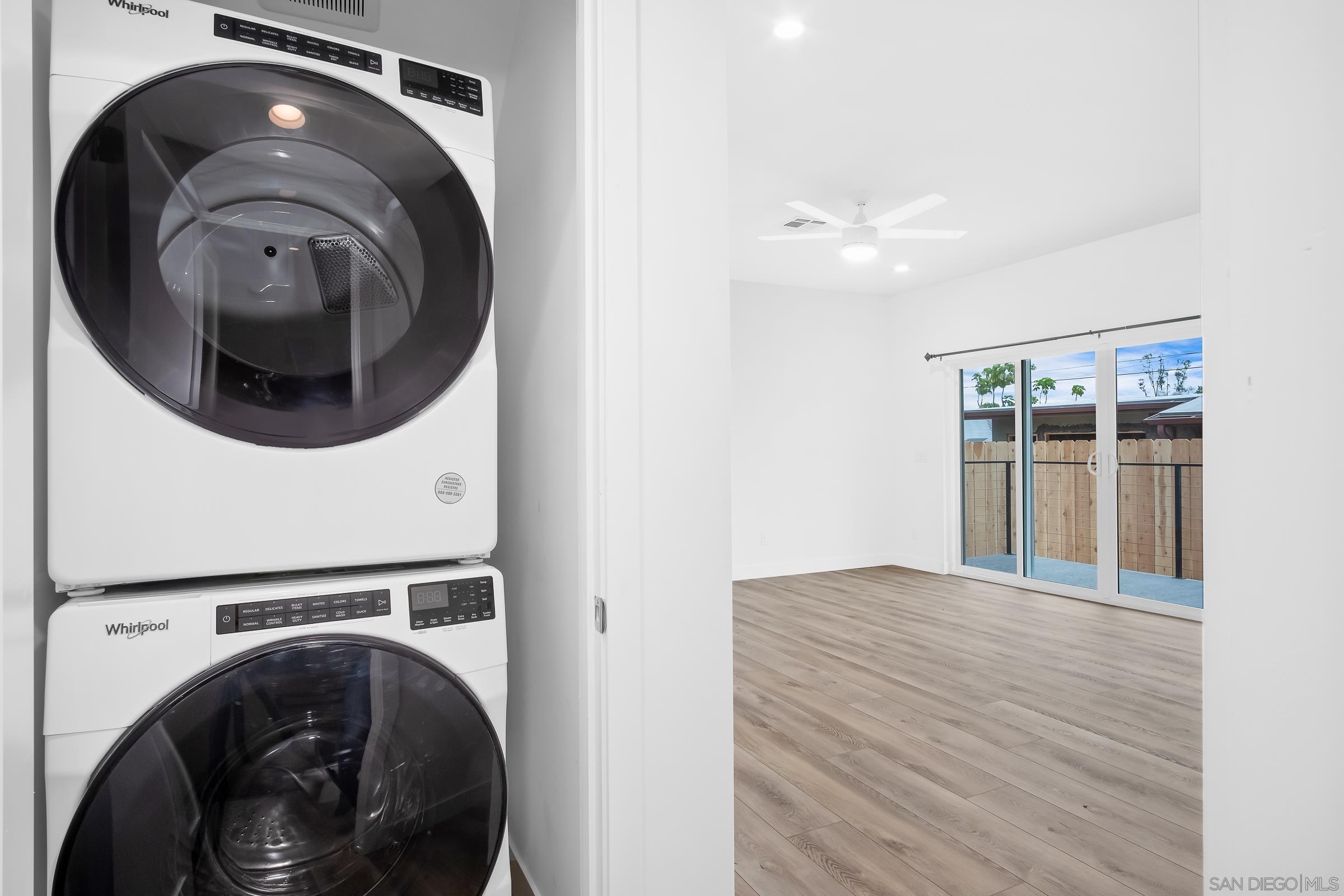5230 Rincon Street San Diego, CA 92115 - Photo 14 of 29 a view of a hallway with washer and dryer