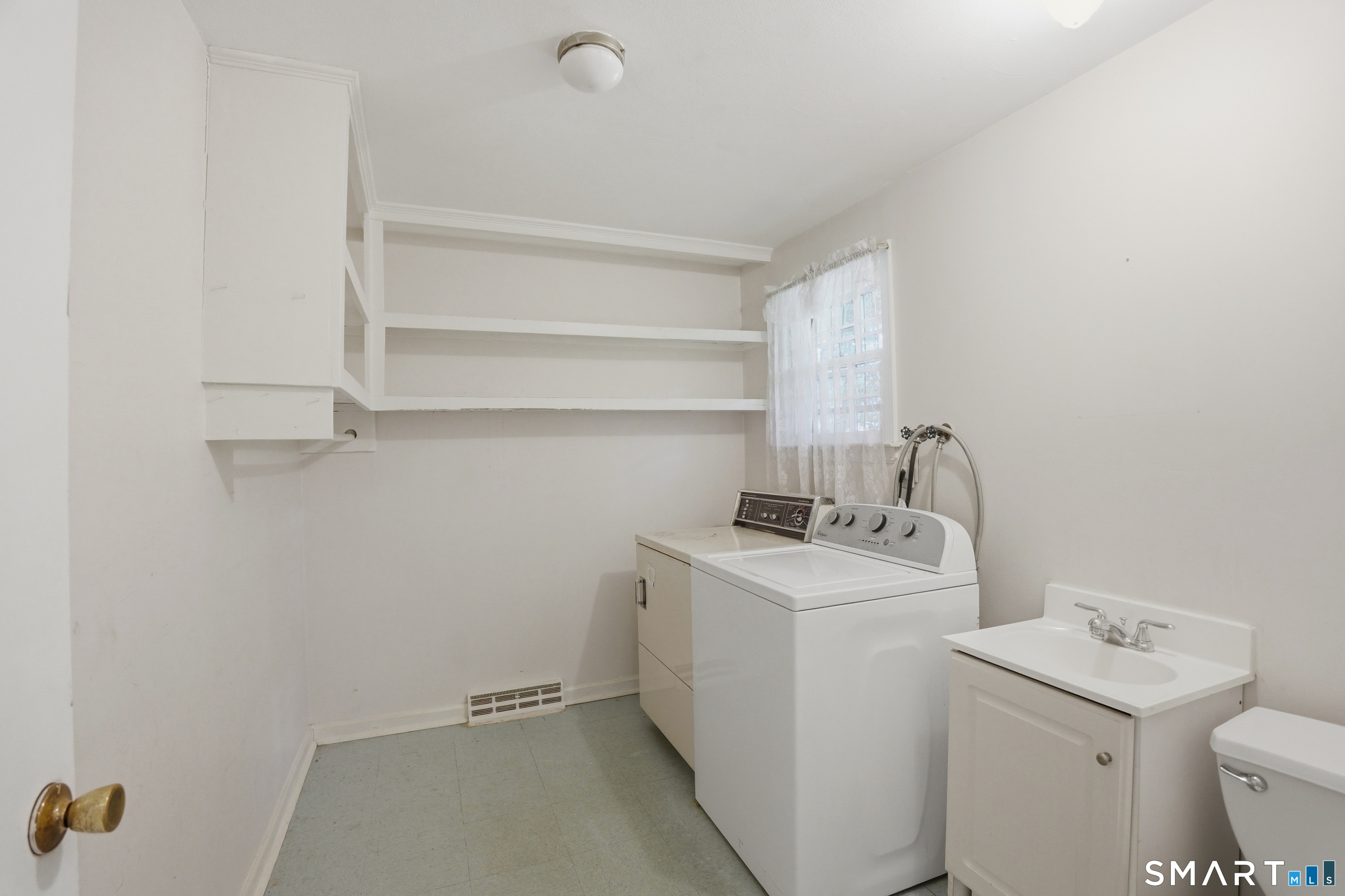 731 Still Hill Road Hamden, CT 06518 - Photo 32 of 40 a utility room with dryer and washer