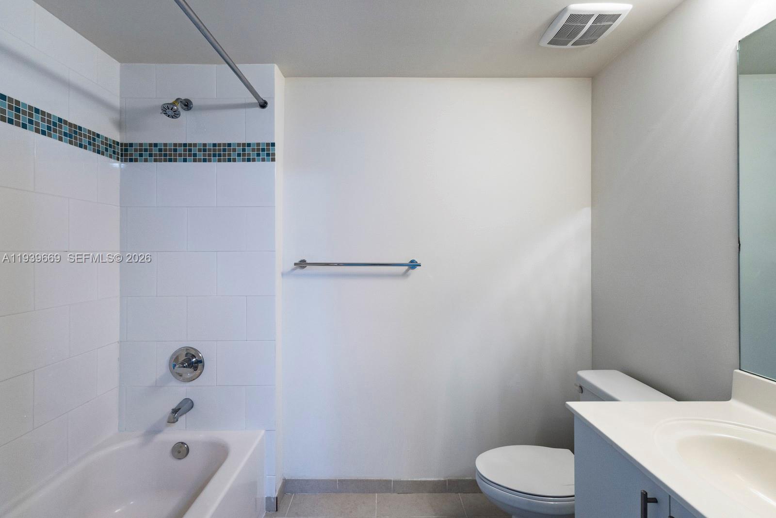 2350 Southwest 27th Avenue, Unit 809 Miami, FL 33145 - Photo 11 of 21 a bathroom with a toilet and a bathtub