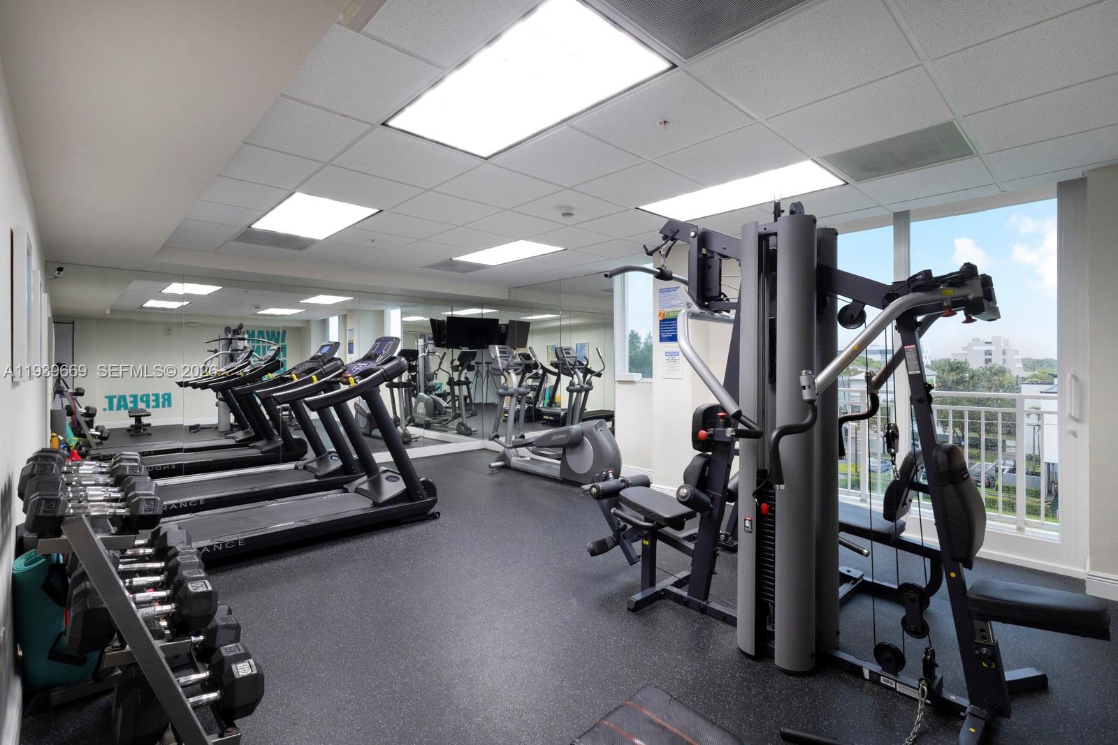 2350 Southwest 27th Avenue, Unit 809 Miami, FL 33145 - Photo 17 of 21 a view of a room with gym equipment