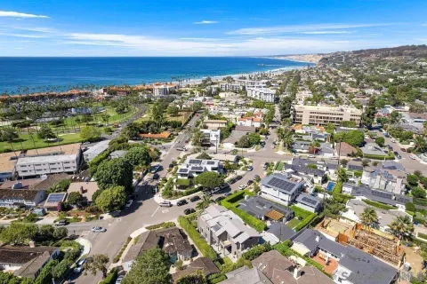 an aerial view of residential building with parking space