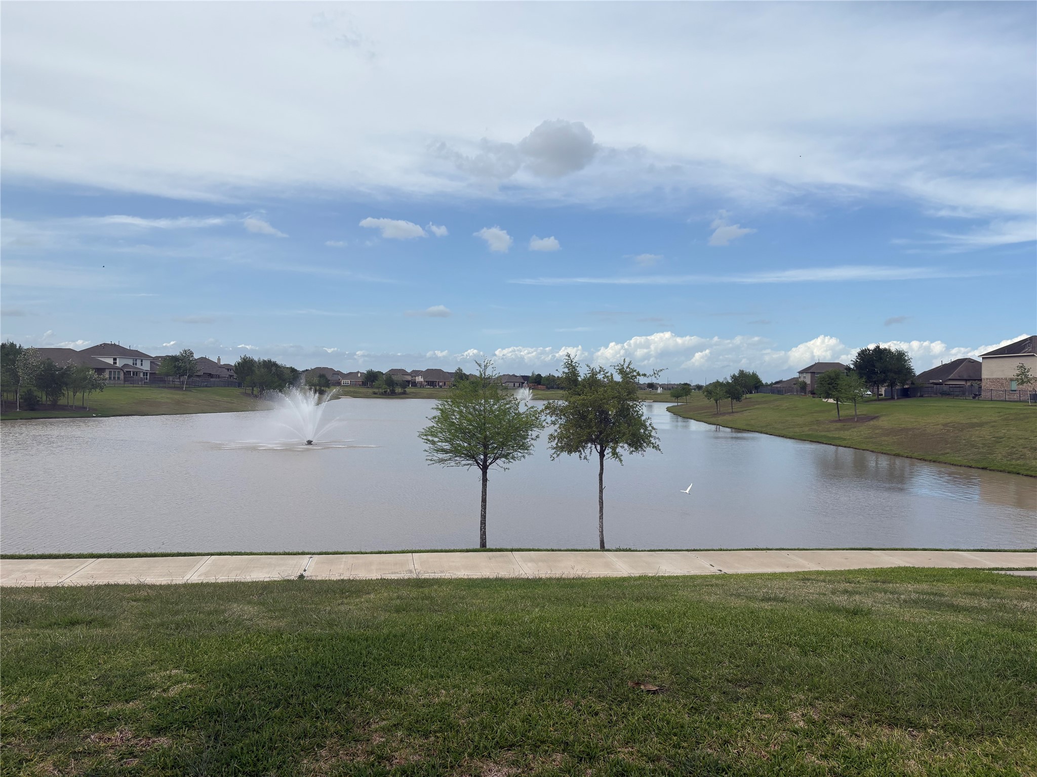 5139 Spring Terrace Lane Rosharon, TX 77583 - Photo 5 of 7 a view of a lake with houses in background