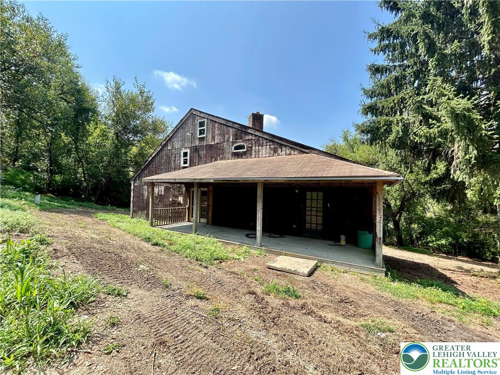 a house with trees in the background