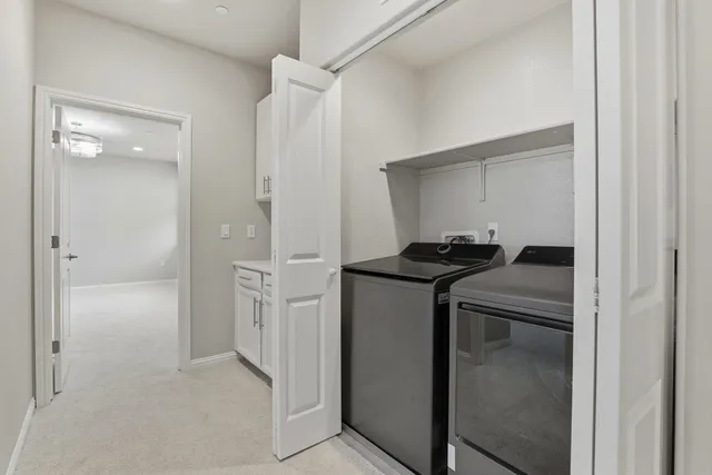 a kitchen that has a refrigerator and a sink