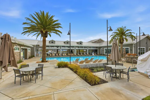 a view of a swimming pool with chairs