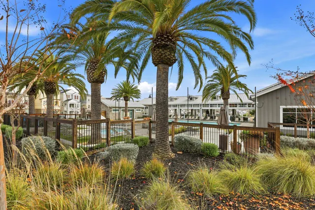 a view of swimming pool with outdoor seating and city view