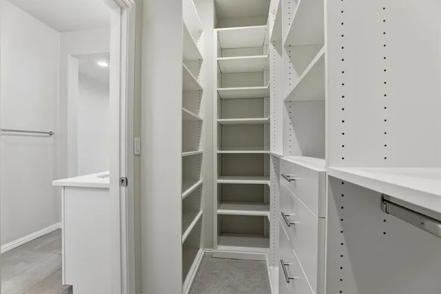 a view of an empty walk in closet