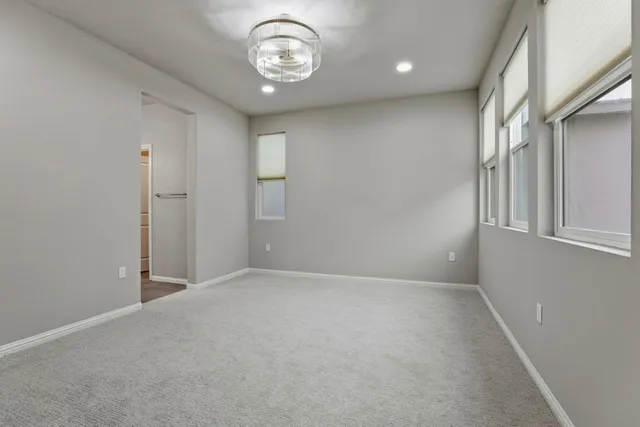 an empty room with a fan