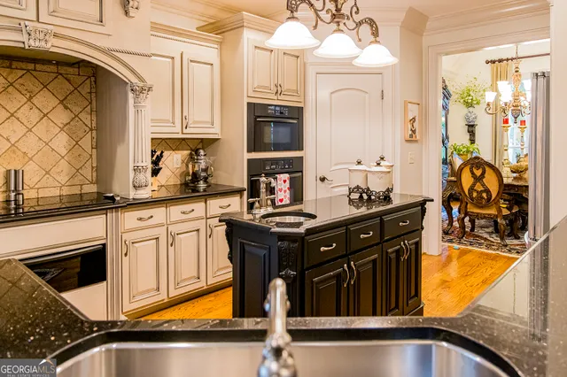 a bedroom with a bed and a dresser in it