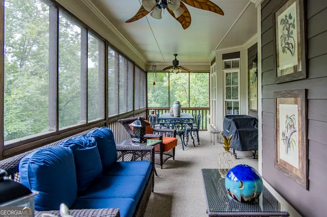 a bedroom with bed a couch and a chandelier