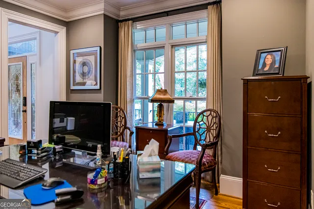 a view of a dining room with furniture window and outside view