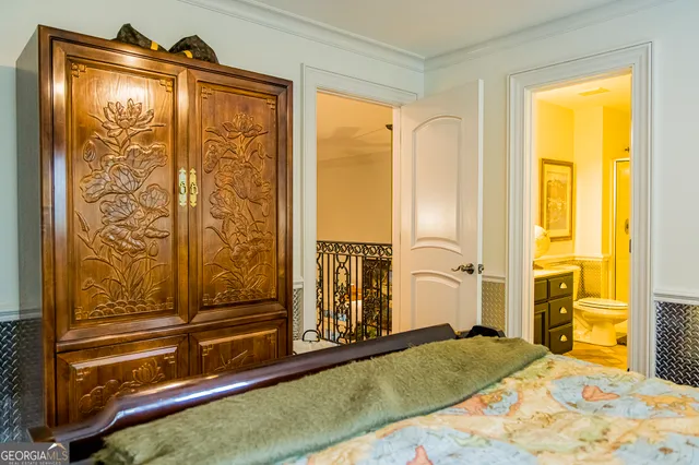 a living room with stainless steel appliances kitchen island granite countertop furniture wooden floor and a view of kitchen