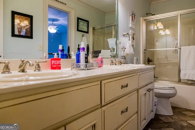 a view of a chair and tables in the balcony