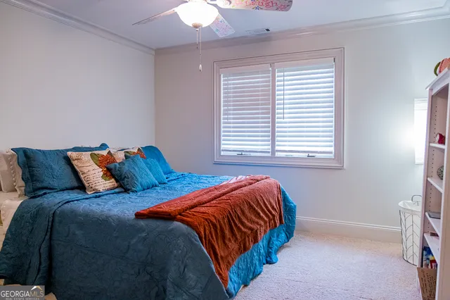 a view of a house with swimming pool and sitting area