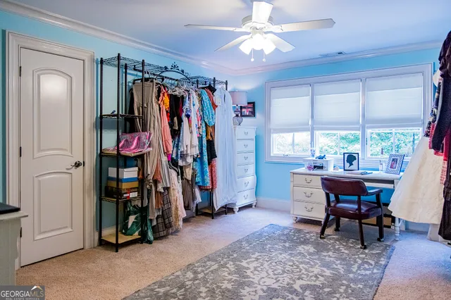 a view of a house with swimming pool and sitting area