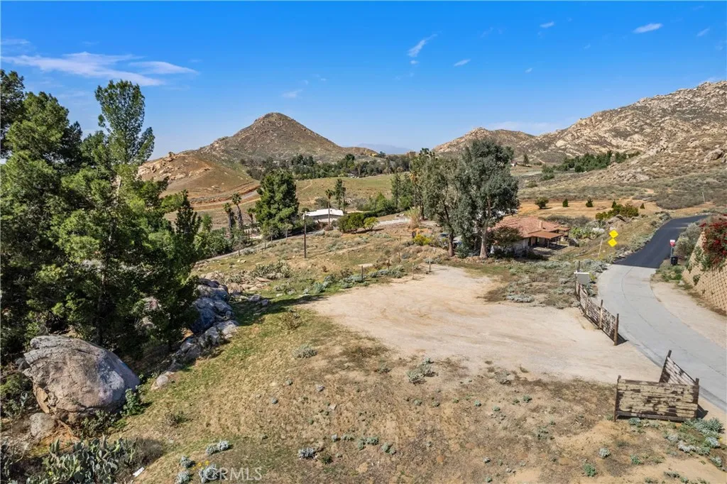 2935 Galaxie Road Riverside, CA 92507 - Photo 4 of 35 a view of a dry yard with trees