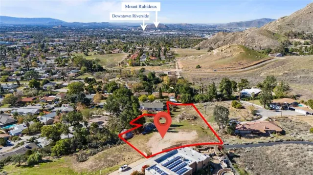 a view of a city with mountains in the background