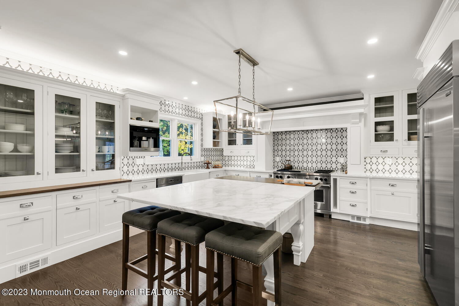 124 Rumson Road Rumson, NJ 07760 - Photo 6 of 52 a kitchen with granite countertop a stove a table and chairs in it