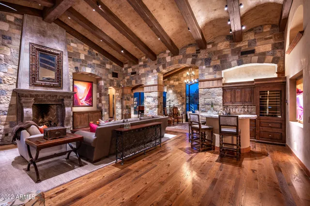a view of a chairs and tables in a patio