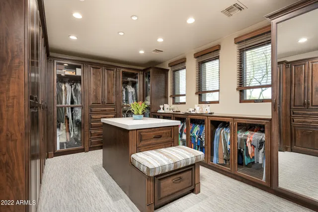 a living room with stainless steel appliances granite countertop furniture and a kitchen view