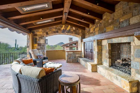 a outdoor living space with furniture and a fireplace