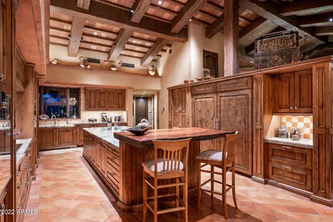 a kitchen with stainless steel appliances granite countertop a stove and a refrigerator