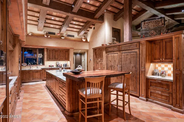 a kitchen with stainless steel appliances granite countertop a stove and a refrigerator