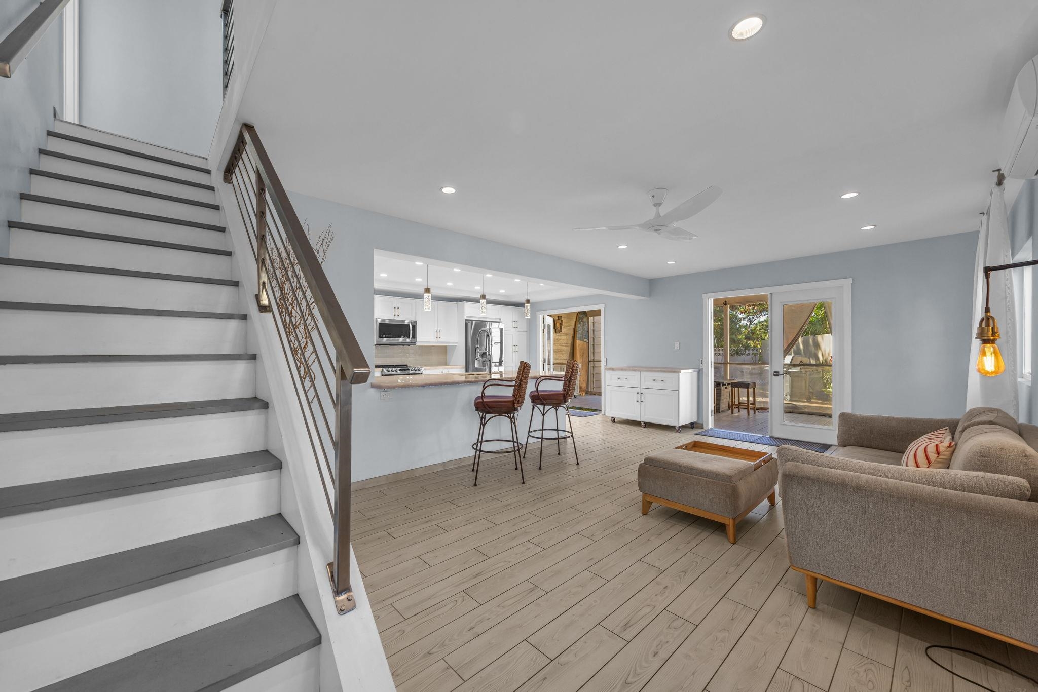 100 Auhana Road, Unit 103 Kihei, HI 96753 - Photo 19 of 43 a living room with furniture and a table