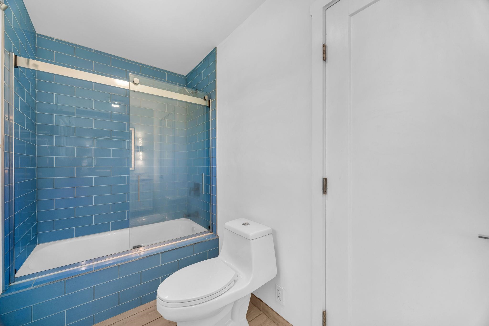 100 Auhana Road, Unit 103 Kihei, HI 96753 - Photo 20 of 43 a bathroom with a bathtub and a shower