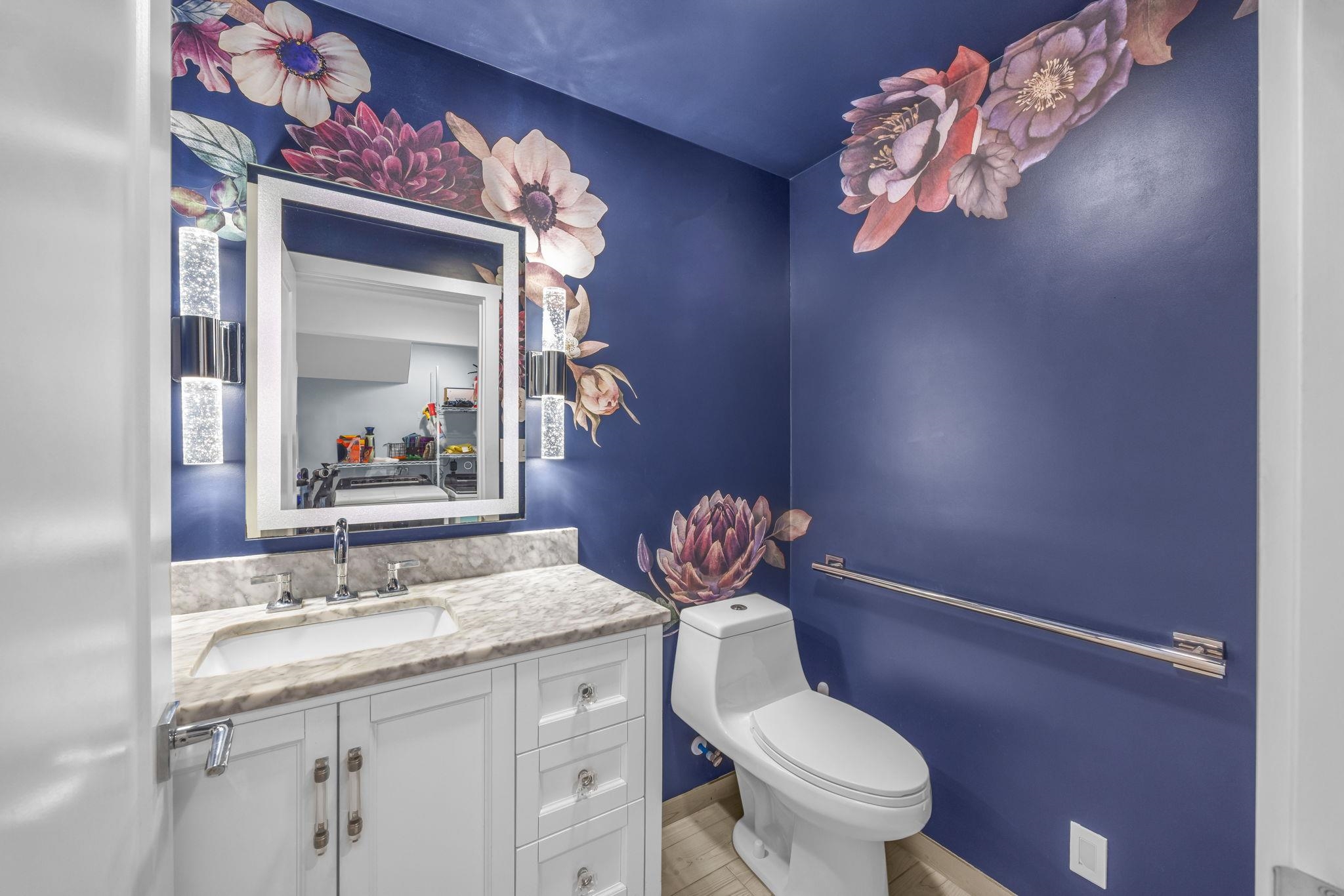 100 Auhana Road, Unit 103 Kihei, HI 96753 - Photo 31 of 43 a bathroom with a granite countertop toilet sink and mirror