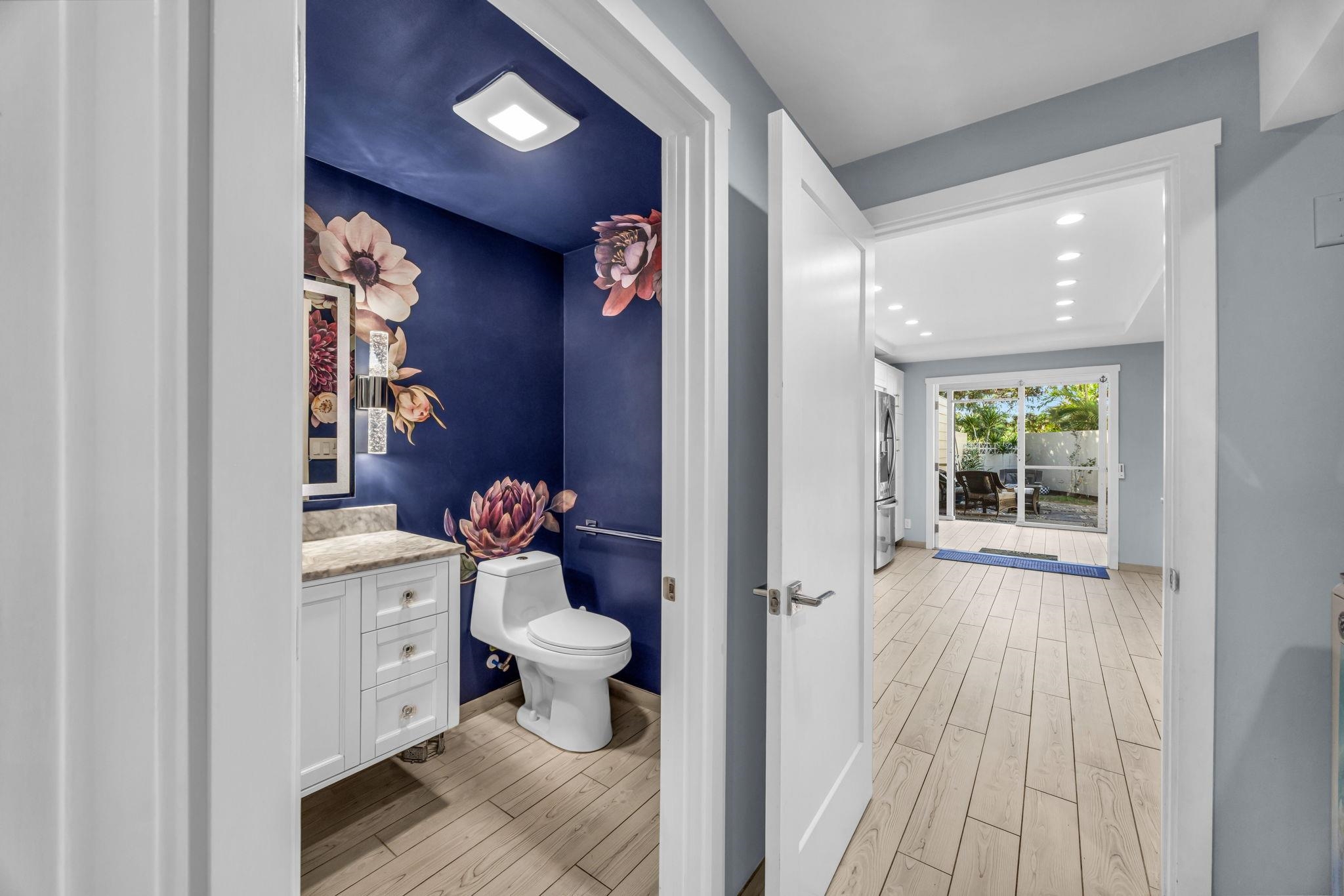 100 Auhana Road, Unit 103 Kihei, HI 96753 - Photo 32 of 43 a bathroom with a sink and a mirror
