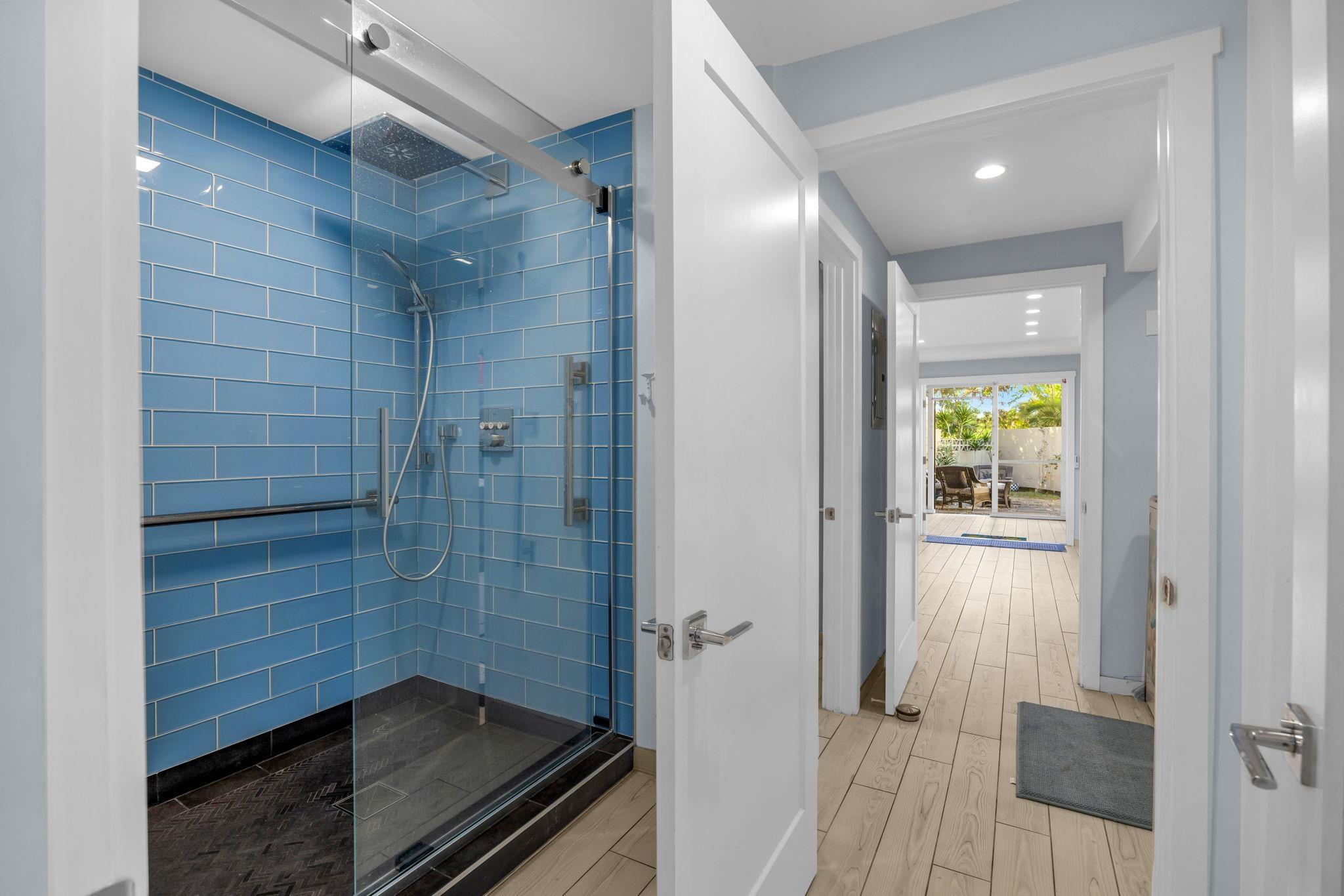 100 Auhana Road, Unit 103 Kihei, HI 96753 - Photo 33 of 43 a bathroom with a glass shower door