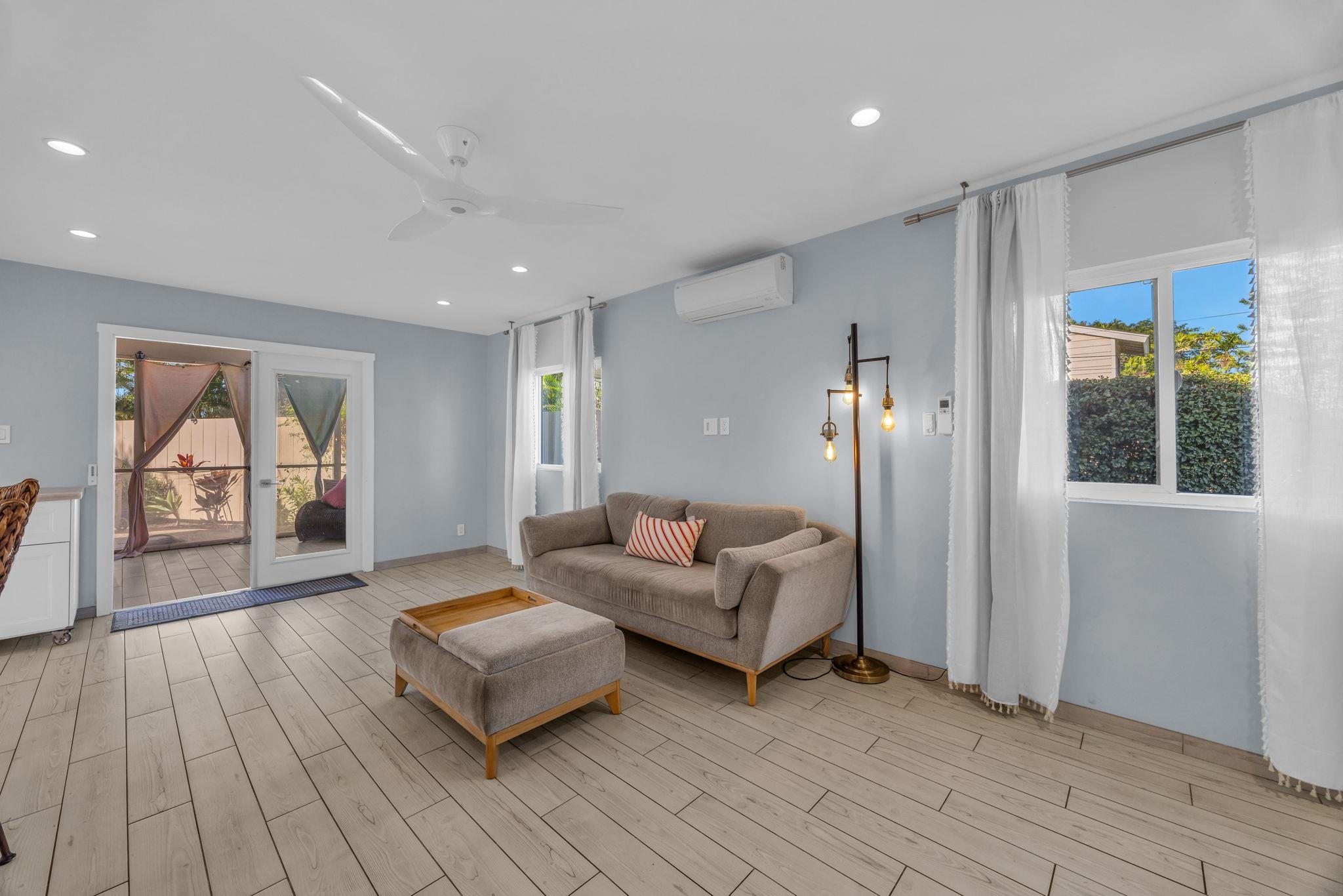 100 Auhana Road, Unit 103 Kihei, HI 96753 - Photo 6 of 43 a living room with furniture and a window