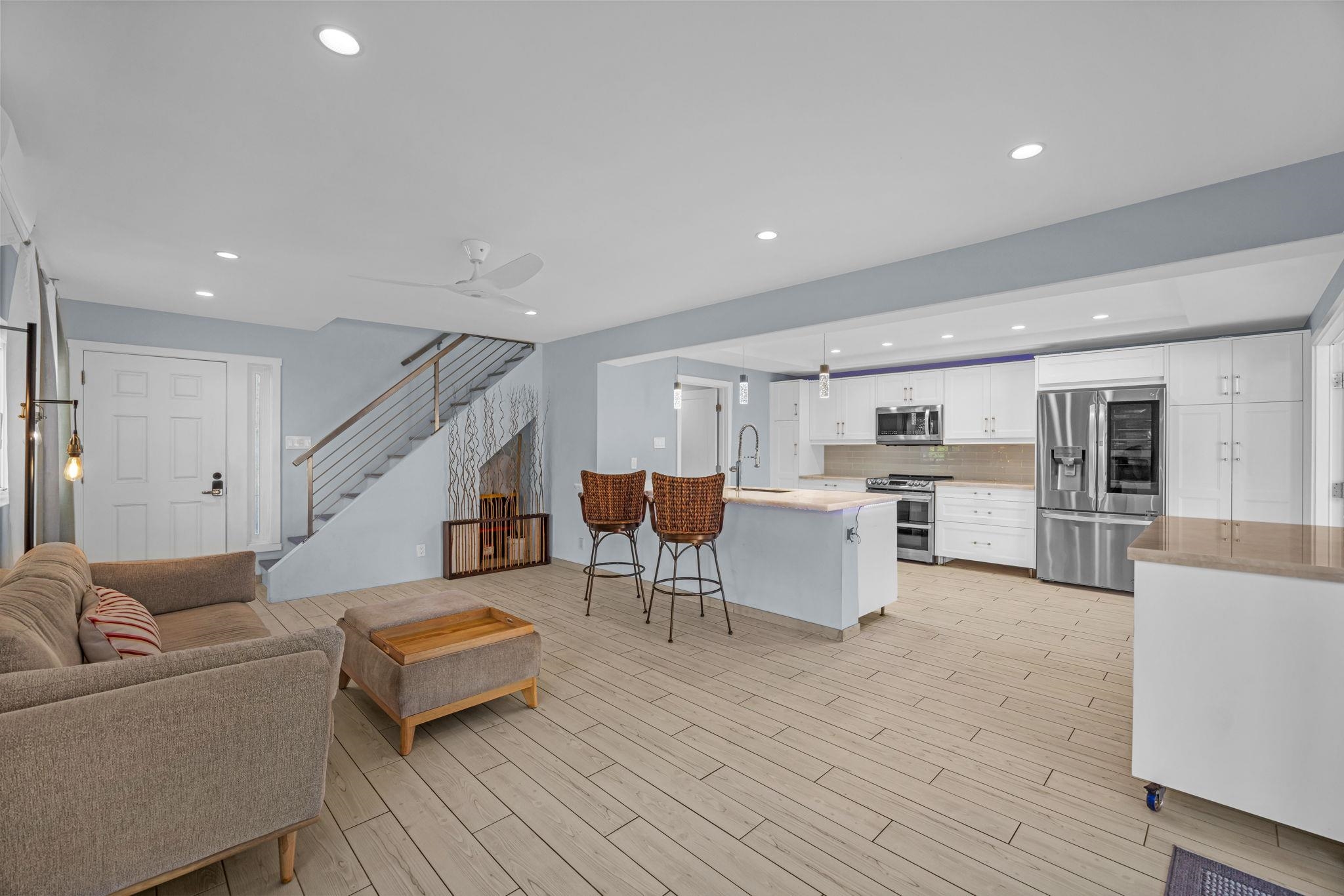 100 Auhana Road, Unit 103 Kihei, HI 96753 - Photo 7 of 43 a living room with furniture and kitchen view