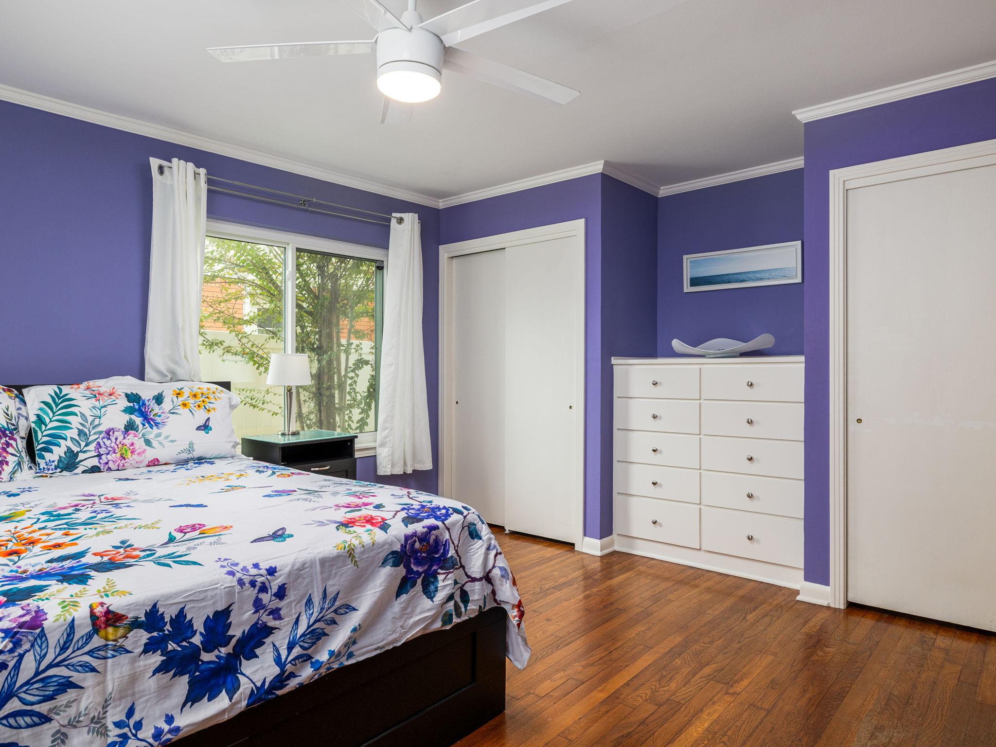 4710 Frontier Trail Austin, TX 78745 - Photo 17 of 32 a bedroom with a bed and a dresser
